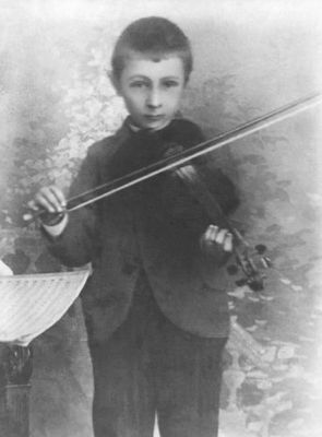 Bohuslav Martinů (1890-1959) as a child, playing the violin, circa 1896