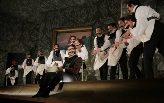Manuel Amati and members of the chorus in 'L'equivoco Stravagante' at the Rossini Opera Festival. Photo © 2019 Studio Amati Bacciardi