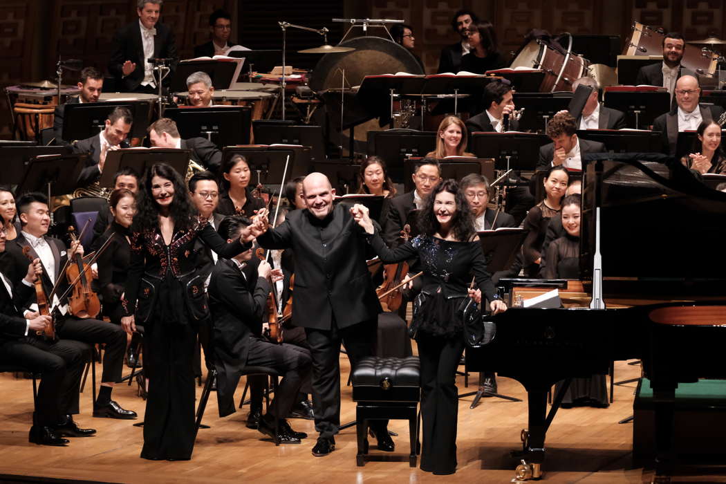 Katia and Marielle Lebèque with conductor Jaap van Zweden and members of the Hong Kong Philharmonic Orchestra. Photo © 2019 Ka Lam
