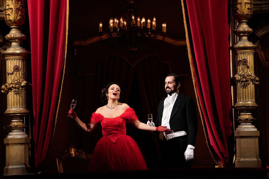 Irina Lungu as Violetta and Gabriele Sagona as Dottore Grenvil in Act I of 'La Traviata' at Teatro Massimo Bellini. Photo © 2021 Giacomo Orlando