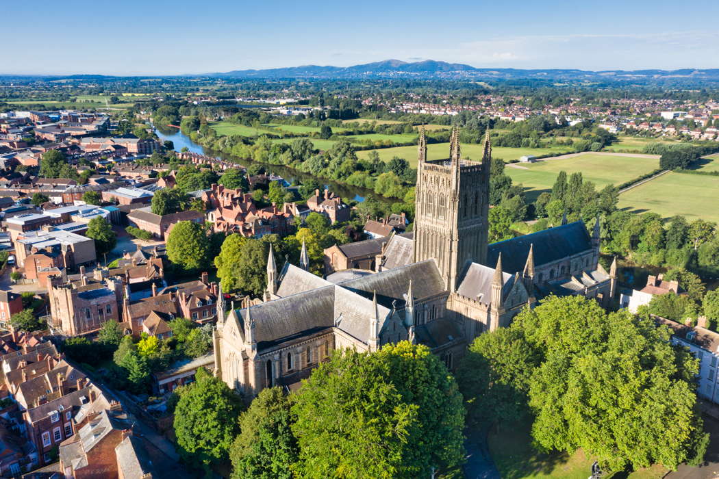 Worcester Cathedral, setting for many Three Choirs Festival events this year, with (left) King's School Worcester, which also hosts Three Choirs events. Behind the cathedral is the River Severn, and in the distance, the Malvern Hills. Photo © 2020 Michael Whitefoot