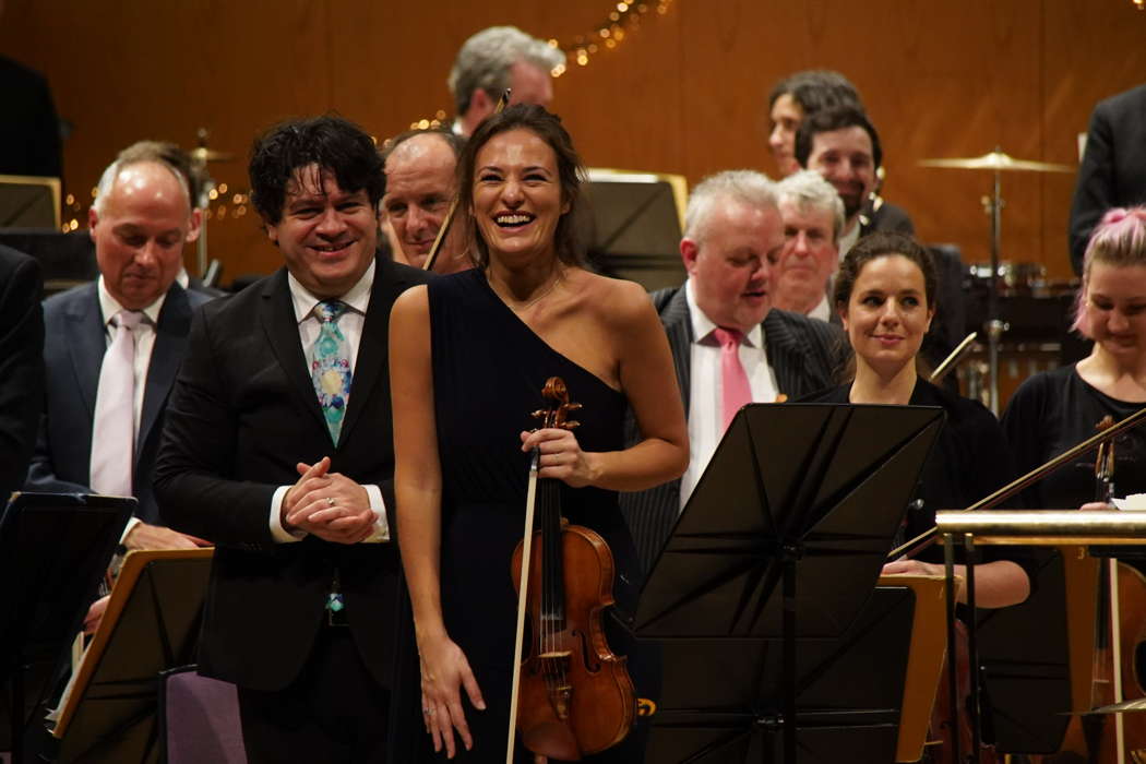 Cristian Măcelaru, Nicola Benedetti and members of the Hallé Orchestra after one of the December 2021 performances of Winton Marsalis' Violin Concerto