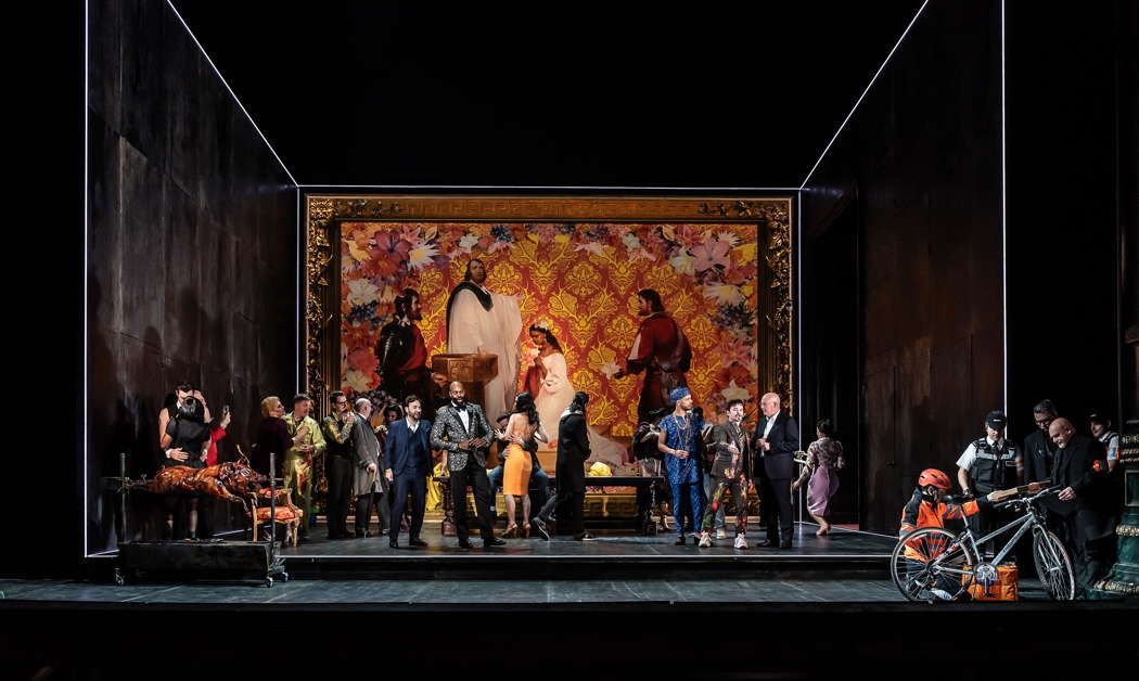 Roman Arndt as the Duke of Mantua, Eric Greene as Rigoletto, Themba Mvula as Marullo, Ross McInroy as Count Ceprano and Campbell Russell as Borsa, with the Chorus of Opera North, in the opening performance of Opera North's production of Verdi's 'Rigoletto' at Leeds Grand Theatre on 22 January 2022. Photo © 2022 Clive Barda
