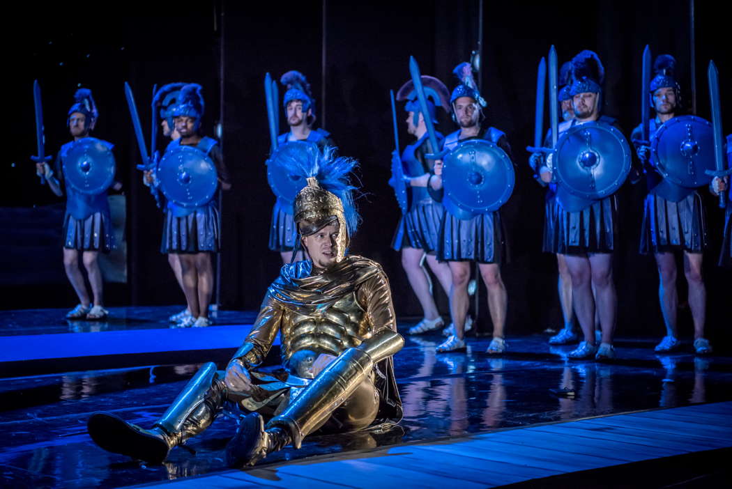 Raimundas Juzuitis (seated, centre) as Haaken Czestikov, with chorus in 'Viva la Diva' at the Buxton Festival. Photo © 2022 Genevieve Girling