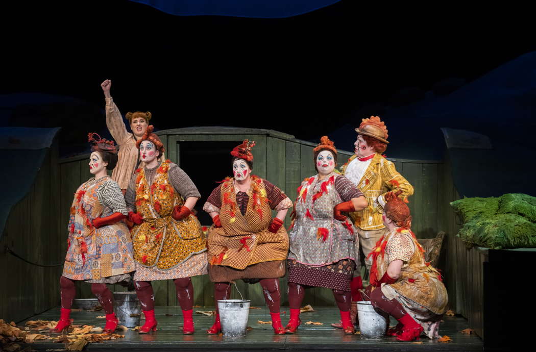 Elin Pritchard as Vixen Sharp Ears, Campbell Russell as Cockerel, Miranda Bevin as Chief Hen and members of the Chorus of Opera North as Hens in Opera North's production of Janáček's 'The Cunning Little Vixen'. Photo © 2023 Tristram Kenton