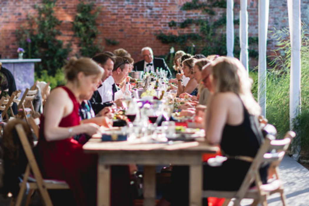 Dining in the kitchen garden area at Nevill Holt