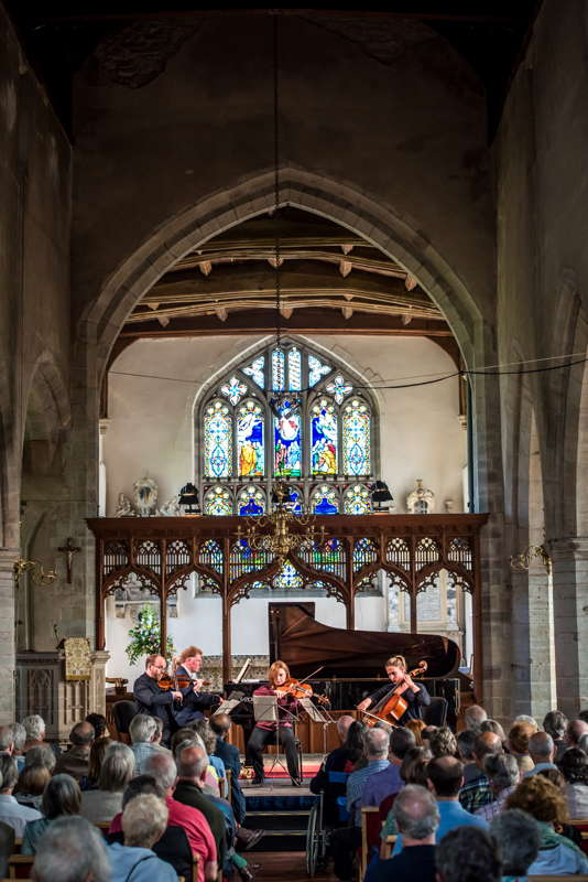 Chamber music in St Andrew's Church as part of the 2017 Presteigne Festival. St Andrew's Church, at which most of the festival's evening concerts take place, has a beautiful acoustic, and is a stone's throw from the Welsh/English border, marked by the River Lugg, which flows from Radnorshire into the River Wye near Hereford, in beautiful border marches countryside. Photo © 2017 Liz Isles