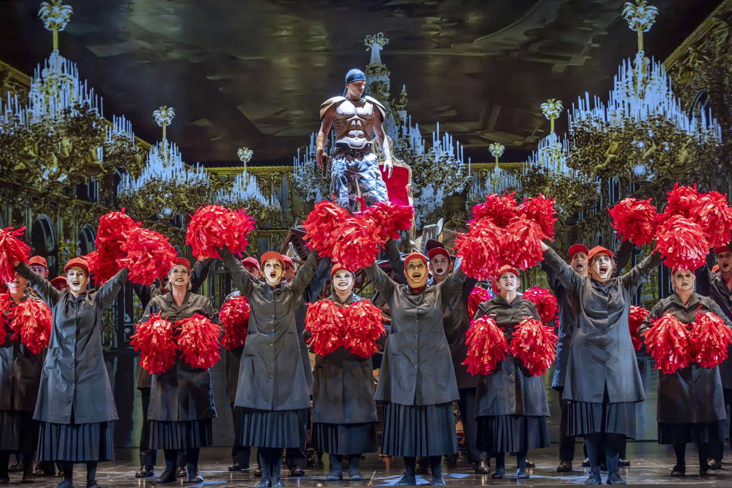 Callum Thorpe as Diktat with members of the Chorus of Opera North in David Pountney's production of 'Masque of Might'. Photo © 2023 James Glossop