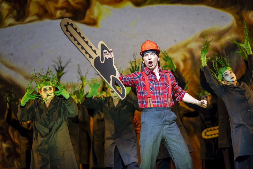 Callum Thorpe as Diktat with members of the Chorus of Opera North in David Pountney's production of 'Masque of Might'. Photo © 2023 James Glossop