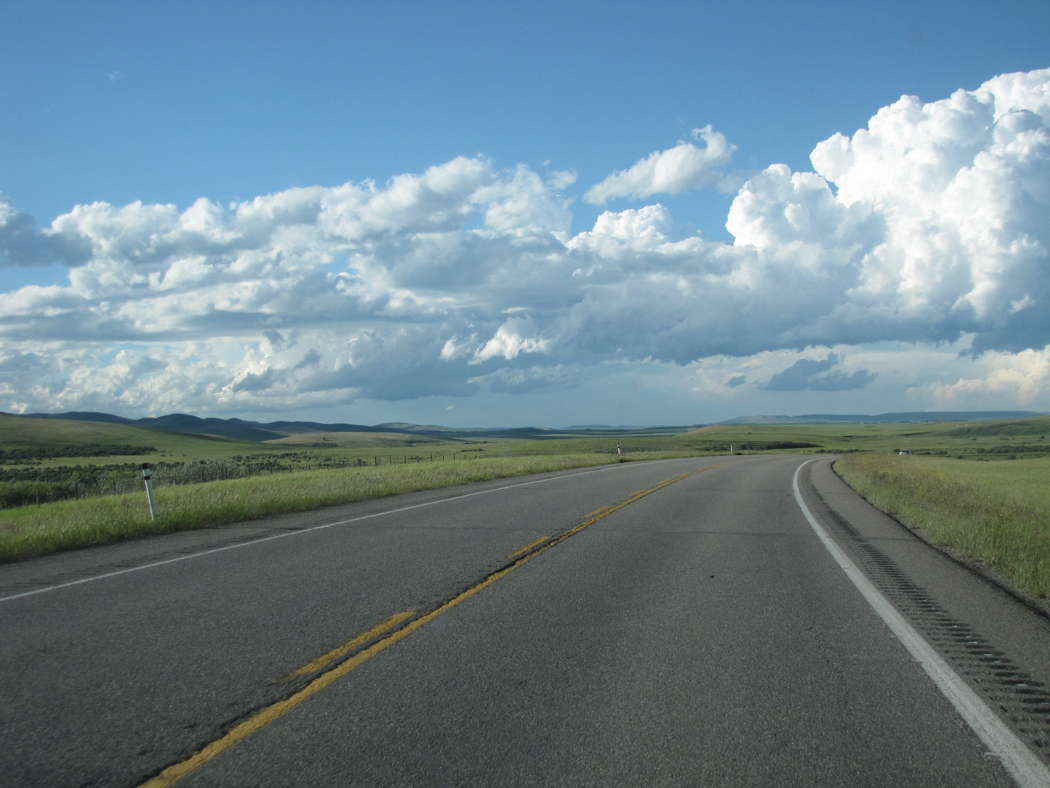 Highway looking out over Alberta Prairie near Crowsnest. Photo © 2023 Adrian Rumson