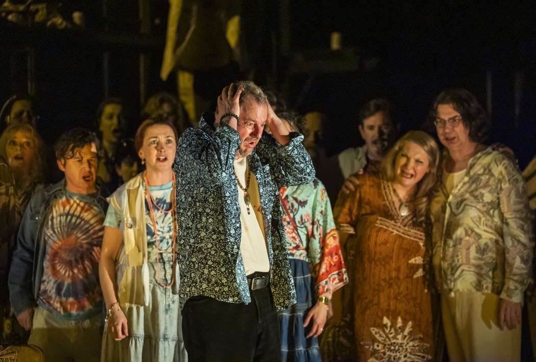 Robert Hayward as Aleko with members of the Chorus of Opera North in Rachmaninov's 'Aleko' at Leeds Grand Theatre on 15 February 2024. Photo © 2024 Tristram Kenton