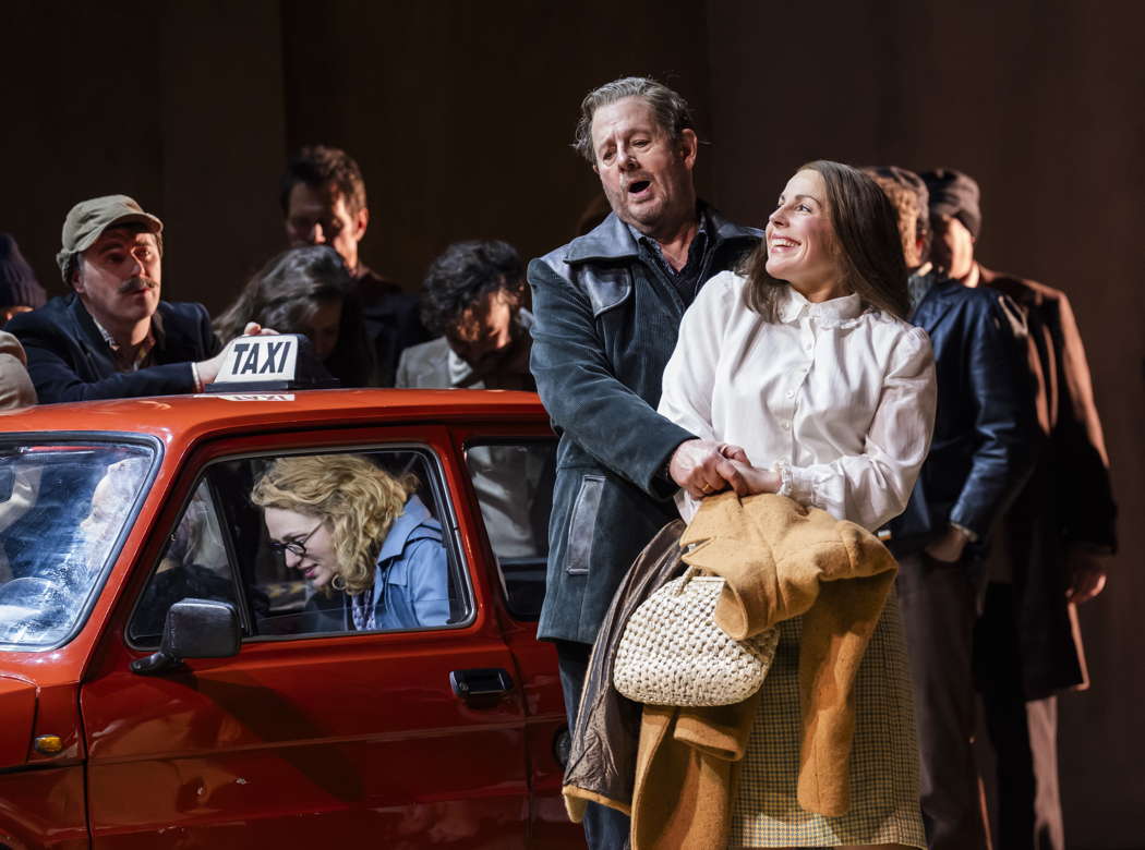 Robert Hayward as Alfio and Helen Évora as Lola with members of the Chorus of Opera North in Mascagni's 'Cavalleria Rusticana' at Leeds Grand Theatre on 15 February 2024. Photo © 2024 Tristram Kenton