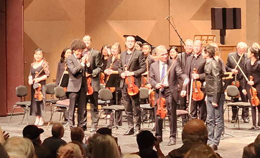 From left to right: Rafael Payare, Gil Shaham and Mason Bates with (behind) members of the San Diego Symphony on 25 February 2024. Photo © 2024 Ron Bierman