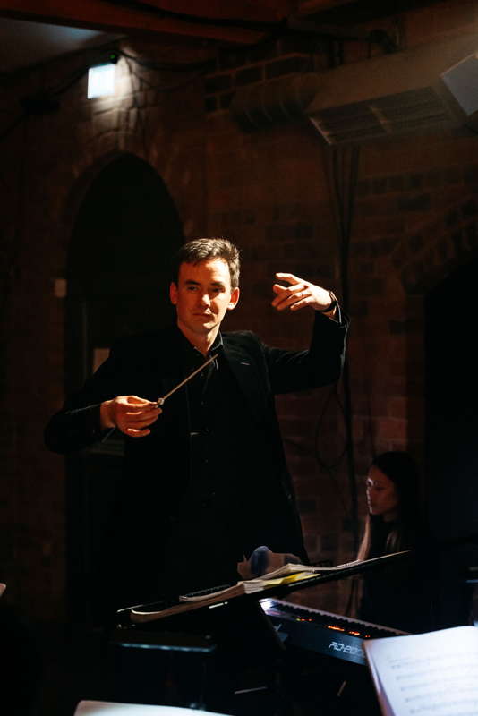 Paul Wingfield, the moving force behind this production, and head of the RBC's Vocal and Operatic Studies, evoking some marvellous playing from his beautifully rehearsed, highly proficient orchestra. Photo © 2024 Greg Milner
