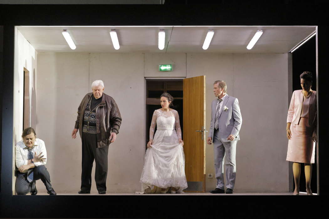 From left to right: Miles Mykkanen as the Bridegroom (Tuomas), Kristinn Sigmundsson as the Priest, Lilian Farahani as the Bride (Stela), Rod Gilfry as the Father-in-Law (Henrik) and Claire de Sévigné as the Mother-in-Law (Patricia) in 'Innocence' by Kaija Saariaho, Sofi Oksanen and Aleksi Barrière at San Francisco Opera. Photo © 2024 Cory Weaver