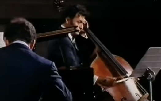 A screenshot from the 1970 Christopher Nupen film showing Zubin Mehta playing double bass in Schubert's 'Trout Quintet'