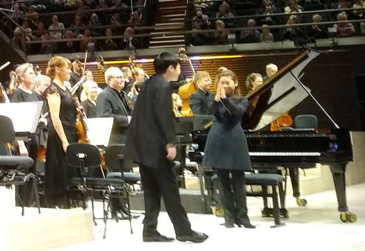 Elim Chan applauds Mao Fujita at the end of his Helsinki Saint-Saëns performance. Photo © 2024 Keith Bramich
