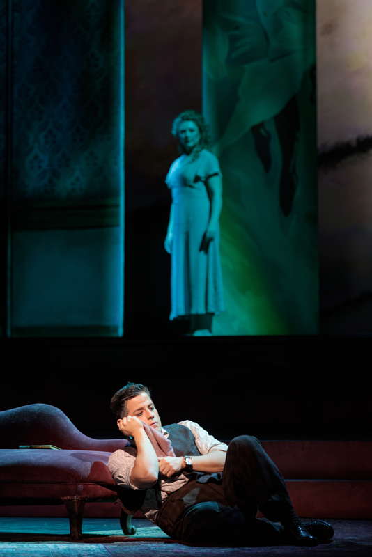 César Delgado as Rodolfo with, above, an image of Sarah Tucker as Mimì. Photo © 2024 Karli Cadel