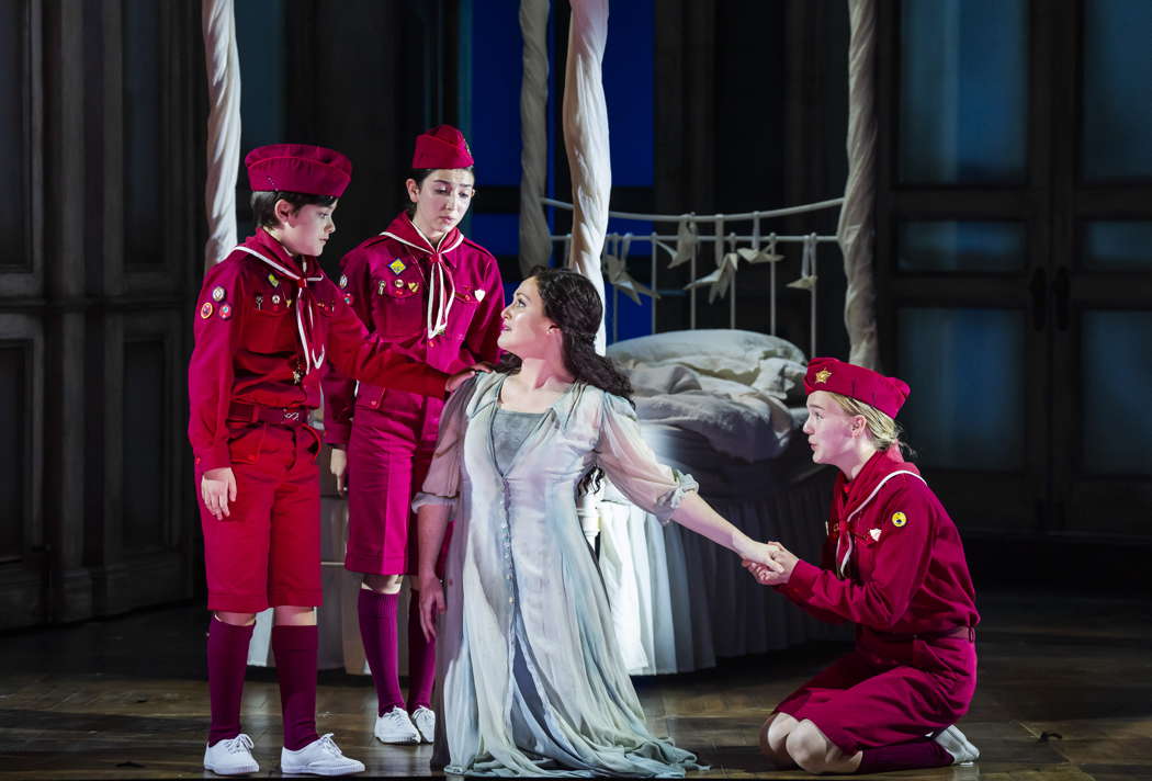The Three Boys - Hector Wainman, Isabelle Baglio and Isla Jones - with Claire Lees as Pamina - in Opera North's production of Mozart's 'The Magic Flute'. Photo © 2024 Tristram Kenton