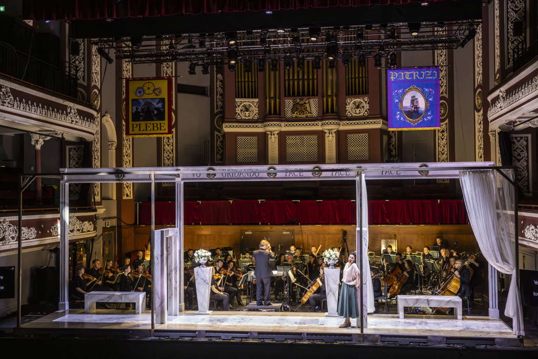 Sara Cortolezzis as Amelia Grimaldi with the Orchestra of Opera North and conductor Anthony Hermus in Opera North's concert staging of Verdi's 'Simon Boccanegra', at the opening performance at St George's Hall, Bradford. Photo © 2025 James Glossop